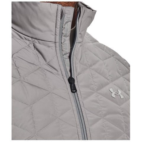 A light gray quilted jacket features a high collar and a front zipper with an Under Armour logo on the chest highlighting a sporty and functional design.