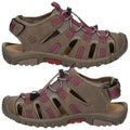 Footwear is a pair of brown sandals with open sides and maroon accents designed for outdoor use featuring adjustable laces and a sturdy sole suitable for various terrains.