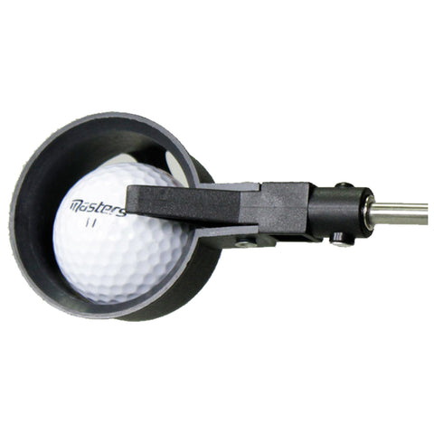 A golf ball is positioned within a black measuring device that holds it securely while a lever extends to adjust its placement for precise alignment in a controlled environment.