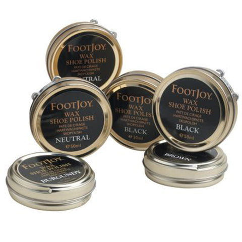 Five metal tins of FootJoy wax shoe polish in various colors including black, brown, burgundy, neutral are arranged closely together showcasing their labels indicating color and size of 50ml.