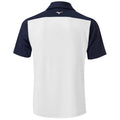 A polo shirt is displayed with a white body and navy blue sleeves the shirt has a collar and a logo visible on the back near the neckline