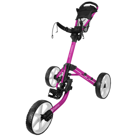 A pink golf trolley with a sturdy frame and large wheels is positioned upright showcasing its handle and basket. It is designed for transporting golf bags on a course.