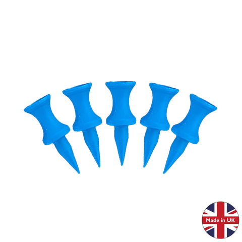 Five blue push pins are arranged in a row with pointed tips facing downward resting on a plain background featuring a label indicating "Made in UK" alongside a British flag.