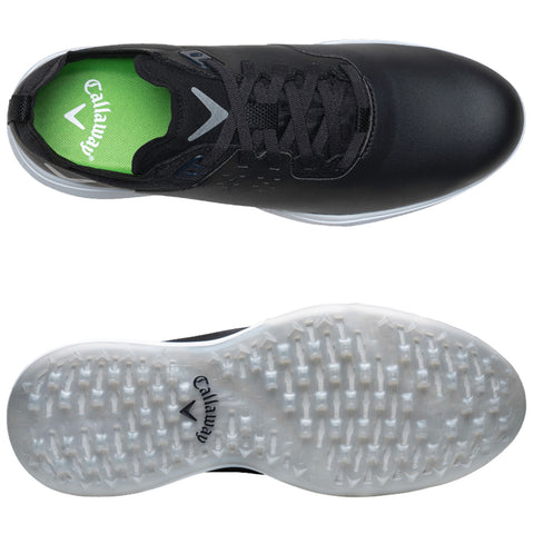 A black athletic shoe with a sleek design features a textured upper and a translucent rubber sole. It includes a bright green insole with branding and is positioned for display.