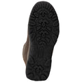 A brown shoe sole with a rugged tread pattern is positioned upwards showcasing its traction design intended for outdoor activities in a neutral or indoor setting.