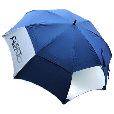 A navy blue umbrella is open displaying a contrasting white interior while positioned against a plain background suggesting it is ready for use in sun or rain protection.