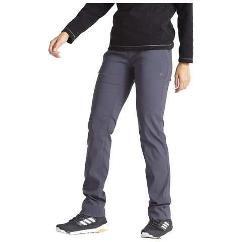 A person is wearing gray outdoor pants and black athletic shoes while standing in a relaxed pose showing athletic clothing suitable for outdoor activities in a neutral setting.