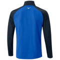 A blue long-sleeve shirt with a black collar and sleeves hangs vertically showcasing a clean design it features a small logo on the upper back area