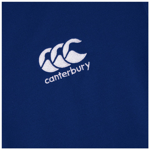 A blue fabric item displays an embroidered logo featuring three stylized waves and the word canterbury below them showcasing a sporty and branded design.