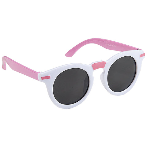 Round sunglasses with a white frame and pink arms are positioned on a flat surface showing dark lenses designed for sun protection while being visually appealing in a casual setting.