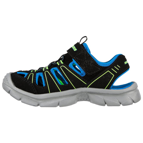 A black and blue sports sandal features a mesh upper with cutouts and a Velcro strap. It has a thick gray sole, designed for comfort and active wear.