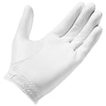 A white golf glove with a fitted design is displayed open with fingers extended showcasing its surface texture and stitching details in a neutral background setting.