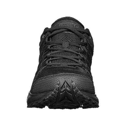 A black athletic shoe is centered in the image showing a textured surface and laces presenting a sporty design meant for outdoor or trail activities with a rugged sole for traction.