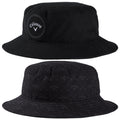 A black bucket hat features a round logo on one side and a patterned design on the other side showcasing golf-related imagery in a subtle monochromatic style.