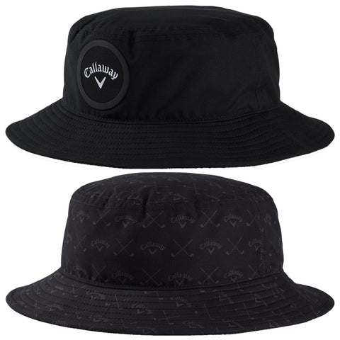 A black bucket hat features a round logo on one side and a patterned design on the other side showcasing golf-related imagery in a subtle monochromatic style.