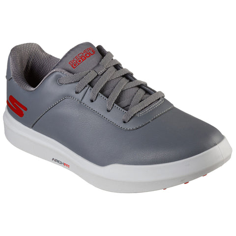 A gray sneaker with a smooth leather exterior and lace-up design rests on a white background featuring a red logo and tag reading "ARCH FIT" in minimalist styling.