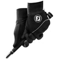 Two black golf gloves grip a golf club's handle with textured surfaces visible on the gloves The gloves are designed for a secure hold during a golf swing