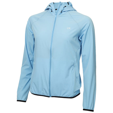 A light blue jacket with a hood is displayed hanging. The jacket is unzipped slightly and features a logo on the upper left side and elastic cuffs at the wrists.