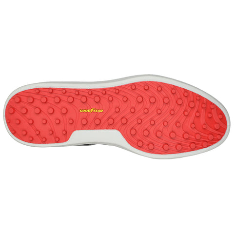 A shoe sole is displayed with a bold red textured surface featuring raised circular patterns and a white border The word GOODYEAR is printed in yellow near the center