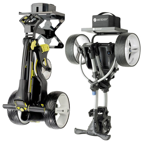 Two electric golf trolleys are positioned side by side in a standing and folded configuration showcasing their wheels and handles designed for transporting golf bags on the course.