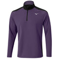 A purple long-sleeve shirt with a black collar and shoulder panels is displayed hanging. It features a quarter zipper and a logo on the left chest area.