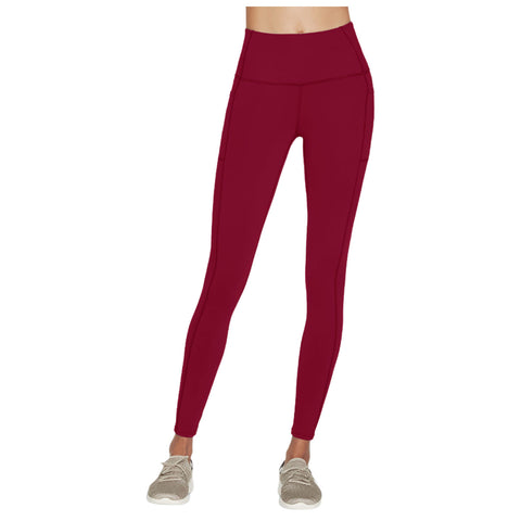 High-waisted red leggings stand upright showcasing their stretchy fabric and side pockets suitable for athletic activities in a neutral, uncluttered background emphasizing their design.