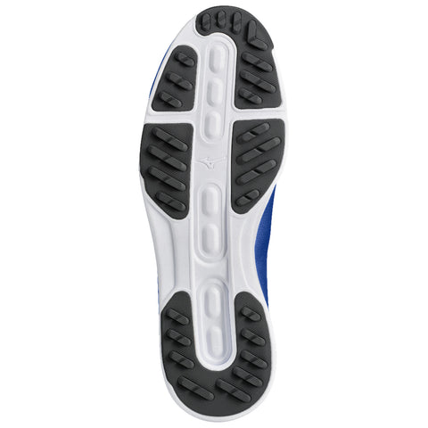 A blue athletic shoe sole is displayed with various textured rubber patterns for grip and traction while resting on a flat surface suggesting it’s ready for running or exercise.