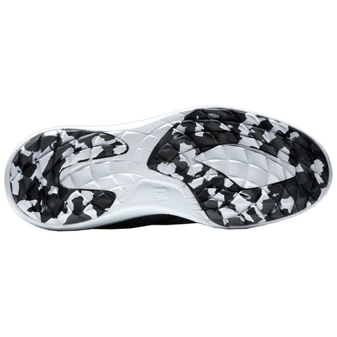 A sneaker sole with a textured surface shows a black and white camo pattern along the grips in various shapes highlighting a design meant for traction on smooth surfaces.