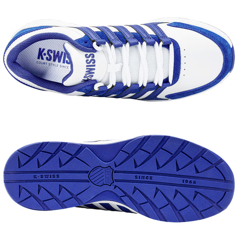 A pair of K-Swiss athletic shoes features a predominantly white upper with blue accents and a mesh tongue. The sole displays a textured grip pattern for traction.