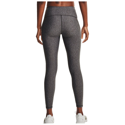 A pair of gray athletic leggings is displayed, featuring a high waistband and a fitted style. They are paired with white athletic shoes on a neutral background.