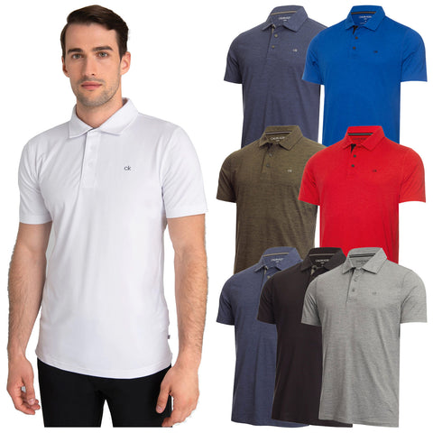 A man stands wearing a white polo shirt while several other polo shirts in various colors hang beside him showcasing options in blue gray black red and green