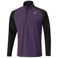 A long-sleeved athletic shirt features a purple torso and black sleeves with a quarter zip collar and a small logo on the chest suitable for active wear and sports.