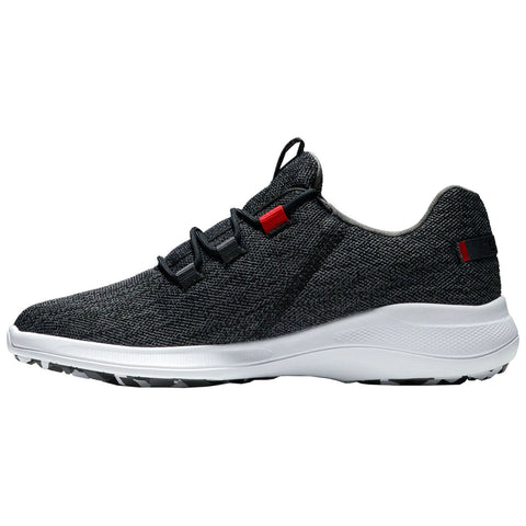 A sneaker features a textured gray upper with black laces and red accents sitting on a white midsole and patterned sole in a neutral setting.