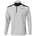 A long-sleeve athletic shirt featuring a zippered collar is displayed in a light gray color with black accents on the shoulders and sides, suitable for activewear or casual use.