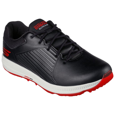 A black athletic shoe with red accents sits upright showcasing a textured upper and laces suggesting it is designed for sports or casual wear in an active lifestyle environment. The brand label is visible on the tongue.