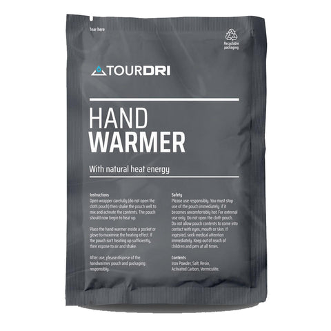 A rectangular packet labeled "HAND WARMER" contains instructions for activation and usage, emphasizing safety precautions. It is designed for warming hands using natural heat energy in cold environments.