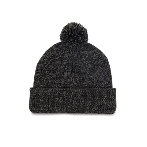 A knitted dark gray beanie hat with a pom-pom on top rests flat on a white background, showcasing its soft texture and cuffed design for warmth and style in cold weather.