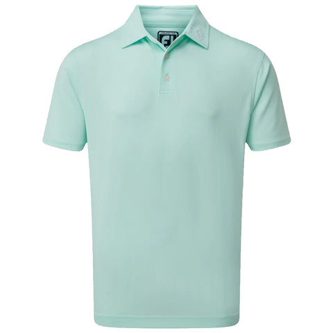 A mint green polo shirt hangs vertically showcasing its short sleeves collar and three buttons at the neck creating a simple yet stylish garment suitable for casual or semi-formal settings.