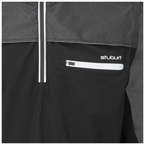 A black and gray jacket features a front zipper and a small zippered pocket at the waist displaying the brand name stuburt in white text against the fabric.