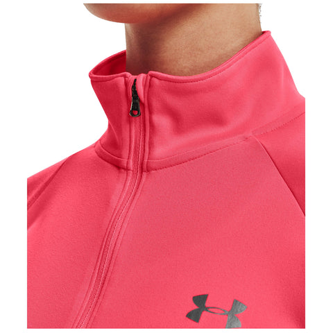 A close-up of a pink athletic jacket features a zippered collar and an Under Armour logo positioned on the chest area against a plain background.