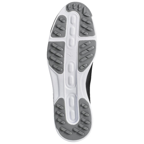 A sneaker sole features a textured black and gray rubber pattern designed for traction and support positioned against a white background highlighting its shape and structure.