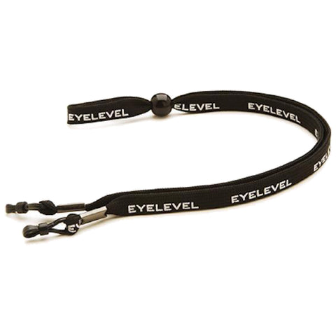 A black eyeglass strap with the word EYLEVEL printed in white is lying flat with two adjustable clips on one end and a bead for tightening in the middle.