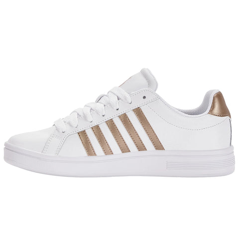 White athletic shoe with gold stripes is positioned sideways displaying its design and lacing details against a plain background highlighting its casual style suitable for everyday wear.