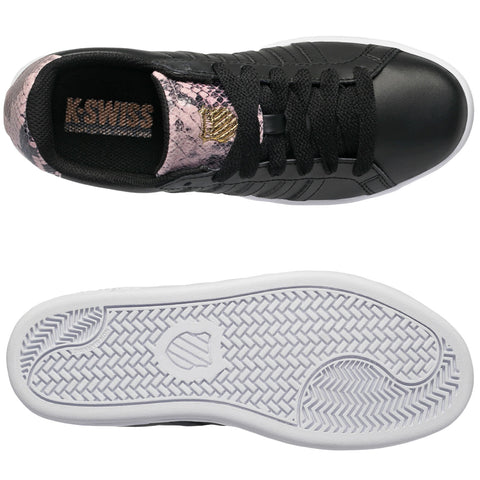 A black sneaker with a pink and black snake skin accent features laces and a textured rubber sole. It is presented from an overhead view against a plain background.