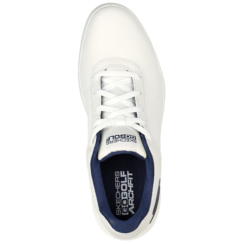 A white athletic shoe is positioned upright showcasing its smooth surface and white laces with a navy blue interior. The brand name Skechers is visibly printed on the insole.