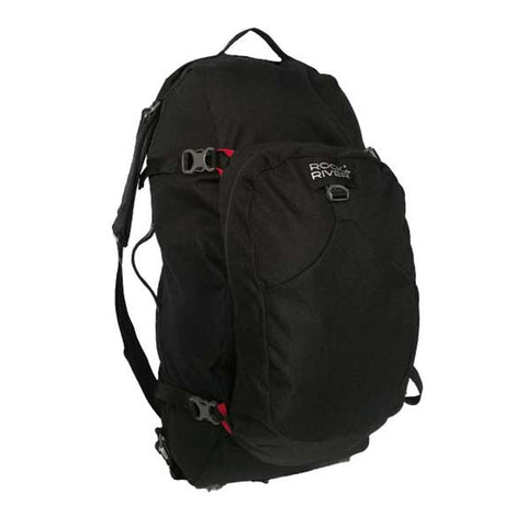 A black backpack with adjustable straps and multiple compartments is displayed, featuring a prominent logo. It is designed for outdoor activities or travel in an adventure context.