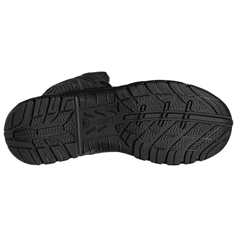 A black boot sole featuring a textured tread pattern is positioned upright The sole is designed for durability and traction with markings indicating slip resistance and oil resistance from a brand logo