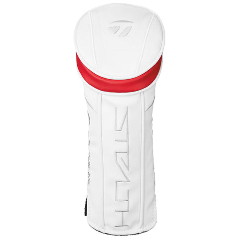 A white golf club headcover stands upright with a red accent on top while showing a sleek design featuring subtle branding and textured details in a neutral background.