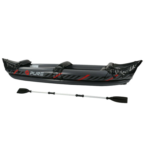 An inflatable kayak is displayed horizontally with a sleek black and red design two black inflatable seats are attached and a paddle rests next to it on a white background.