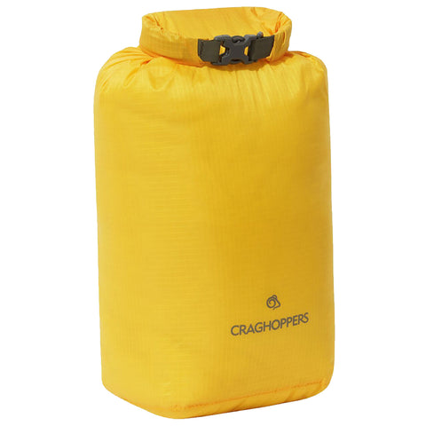 A yellow waterproof storage bag stands upright showcasing its rectangular shape and roll-top closure secured with a buckle designed for outdoor use and protection from water. Craghoppers branding is present.